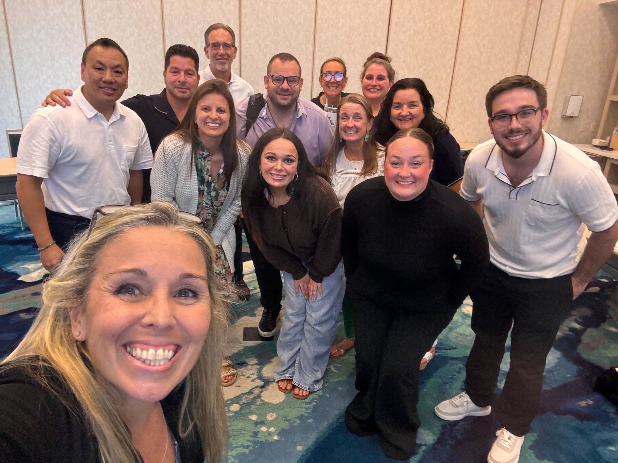 Leprea team members smiling at an event