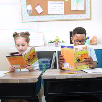students in a classroom reading quietly together