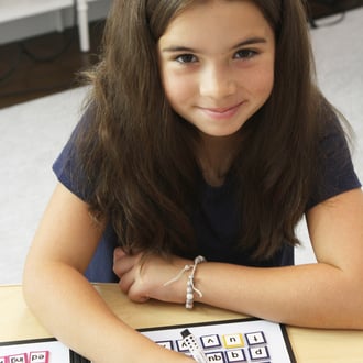 a student smiling while learning